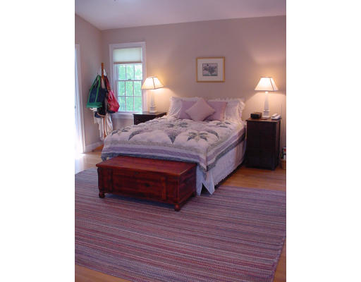 12 Beech Tree Farm Road Scituate, MA 02066 - Photo 21 of 24 a spacious bedroom with a bed and a lamp