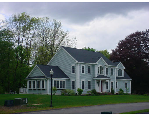 12 Beech Tree Farm Road Scituate, MA 02066 - Photo 6 of 24 a front view of a house with a yard