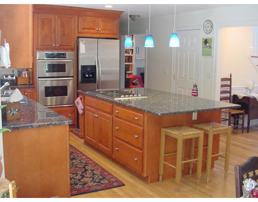12 Beech Tree Farm Road Scituate, MA 02066 - Photo 7 of 24 a kitchen with stainless steel appliances kitchen island granite countertop a table and chairs in it