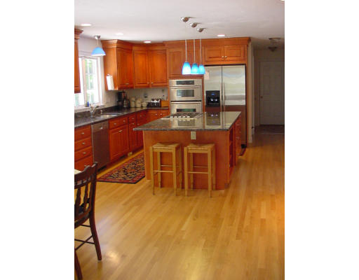 12 Beech Tree Farm Road Scituate, MA 02066 - Photo 9 of 24 a kitchen with stainless steel appliances kitchen island granite countertop a stove and a sink