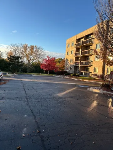 a front view of building with road