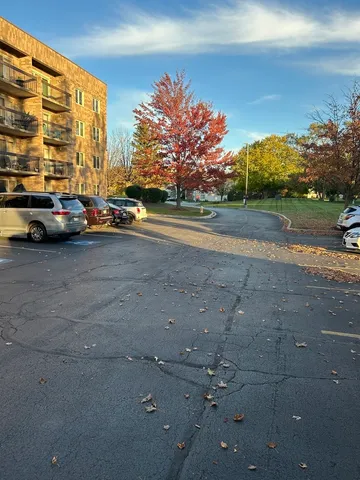 a view of street with parked cars