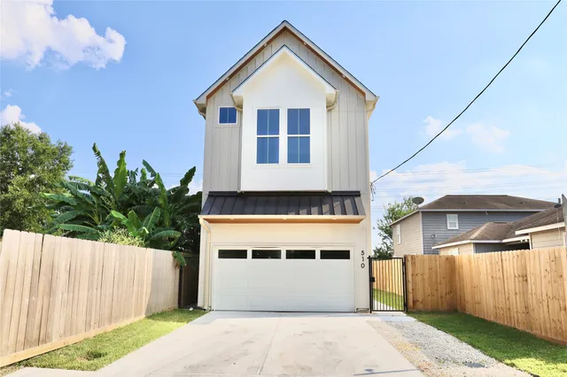 a front view of a house with a garage