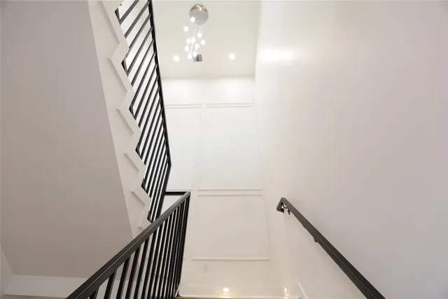 a bathroom with a toilet a sink a vanity and mirror