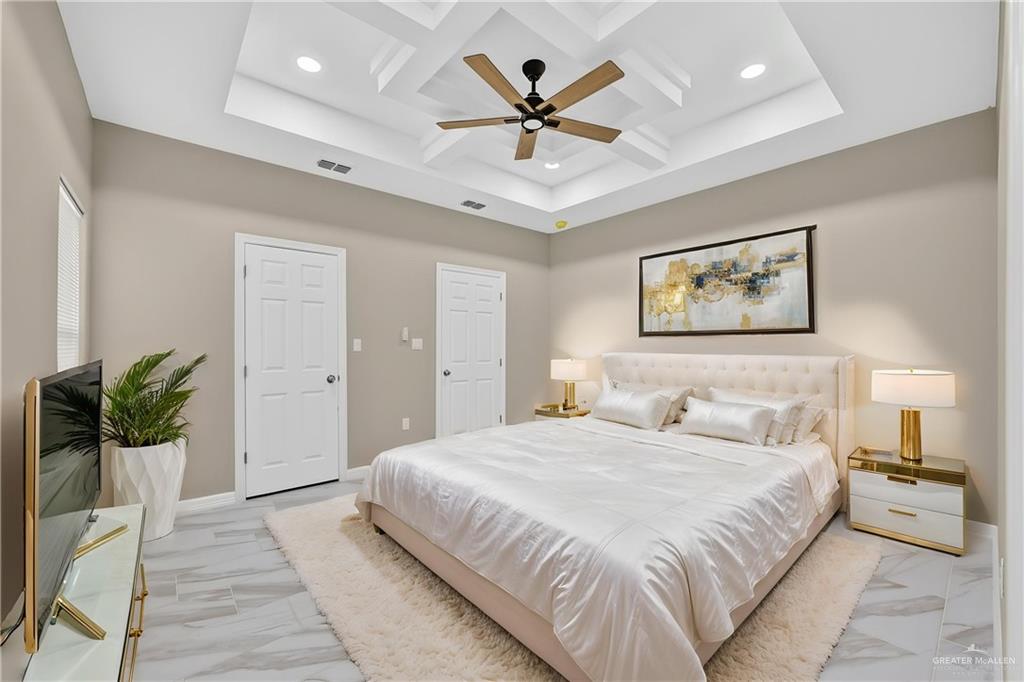 1920 Trinity Street Donna, TX 78537 - Photo 17 of 23 Tray ceiling with recessed lighting and a ceiling fan