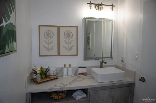a bathroom with a sink and a mirror