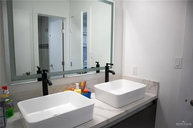 a bedroom with a bed and a wooden floor