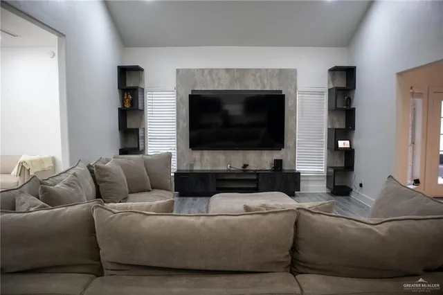 a living room with furniture and a flat screen tv