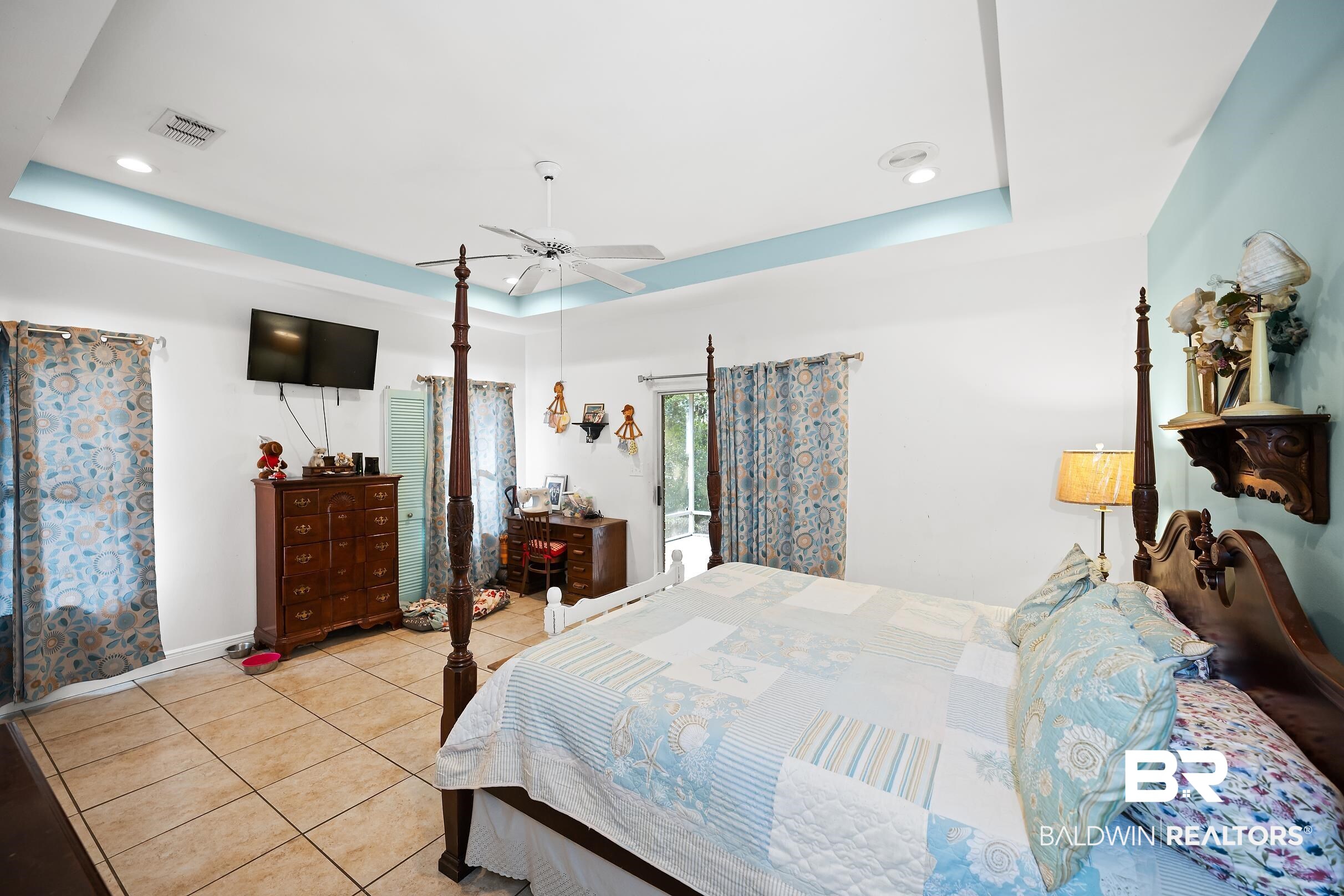 2674 Pine Ridge Drive Lillian, AL 36549 - Photo 11 of 42 Bedroom with a tray ceiling, light tile patterned flooring, ceiling fan, and recessed lighting