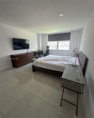 a view of a hallway with wooden shelves