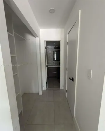 a bathroom with a sink toilet and mirror