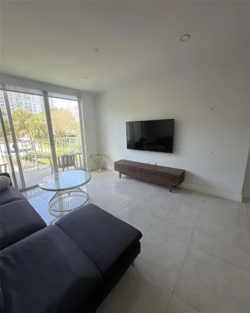 a living room with furniture and a chair