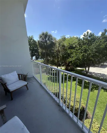 a view of swimming pool from a balcony