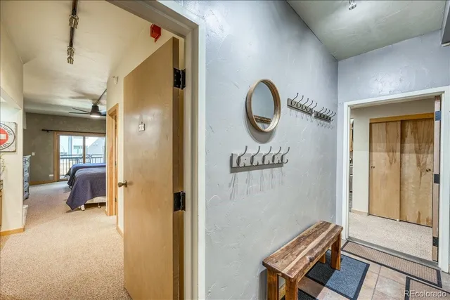 a bathroom with a granite countertop sink a mirror and a shower