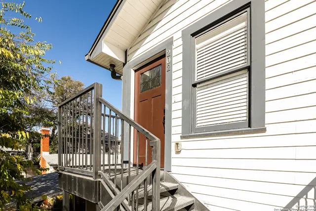 a view of balcony with wooden floor
