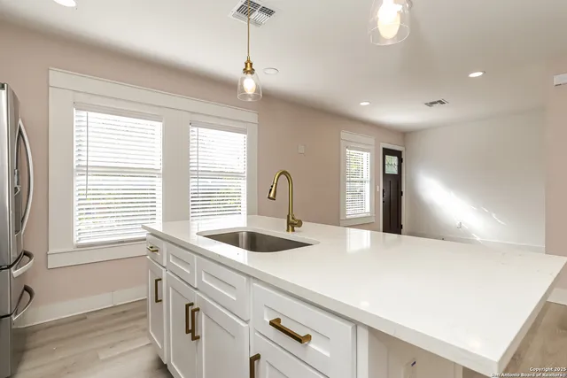 a kitchen with a sink and a window