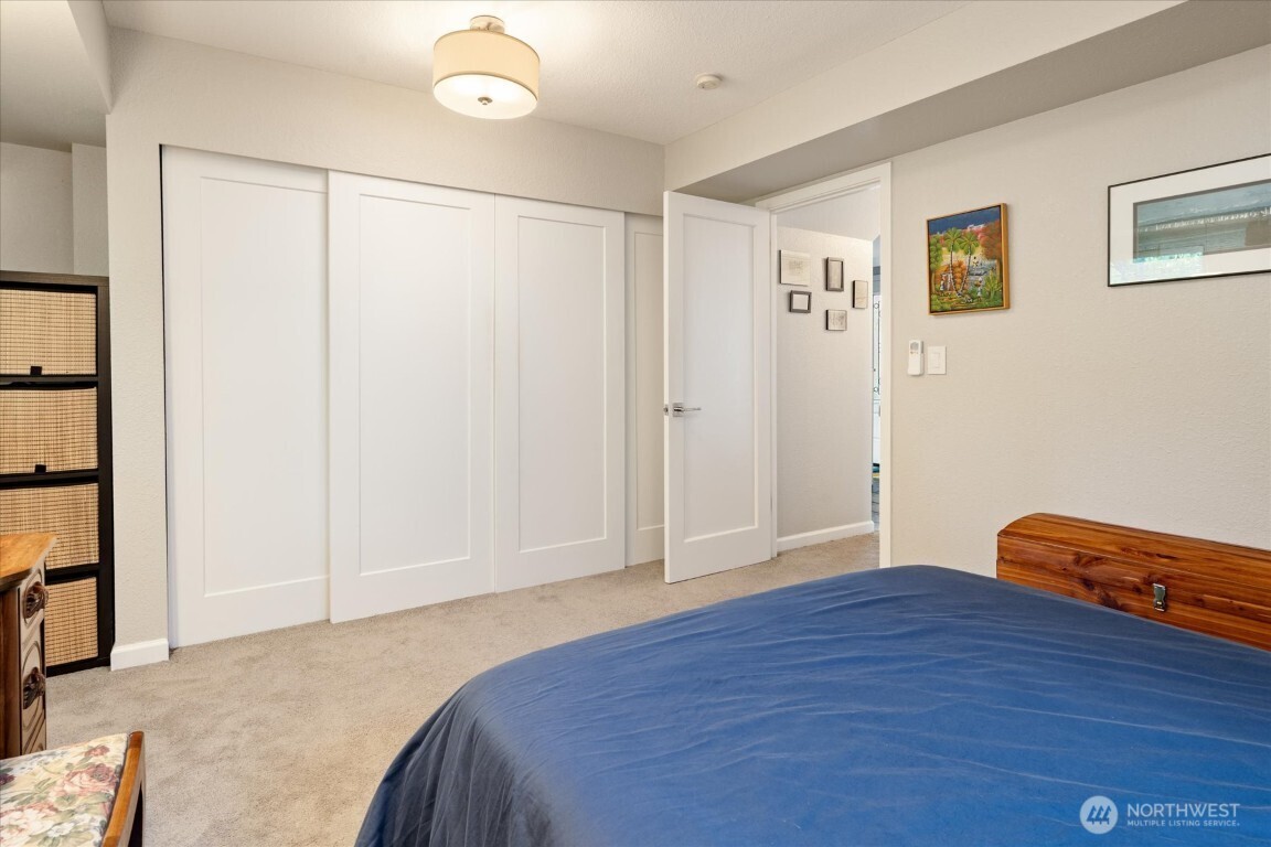 1724 26th Avenue Seattle, WA 98122 - Photo 20 of 28 a bedroom with a bed and cabinets