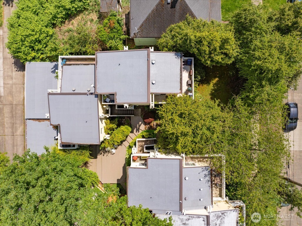 1724 26th Avenue Seattle, WA 98122 - Photo 28 of 28 an aerial view of a house with a yard and garden