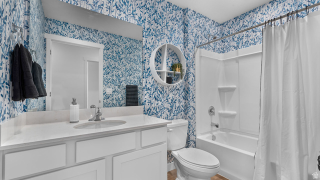2032 East Dorset Way, Unit 286 Salem, UT 84653 - Photo 13 of 23 Full bathroom featuring a white vanity with an integrated sink, a large mirror, and a white toilet