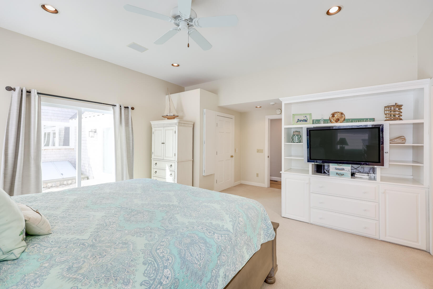 156 Commerce Road Barnstable, MA 02630 - Photo 23 of 54 a bedroom with a bed and a flat screen tv
