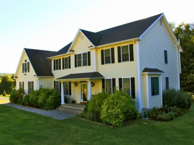 5 Echo Valley Road Oxford, CT 06478 - Photo 1 of 1 a front view of a house with a yard