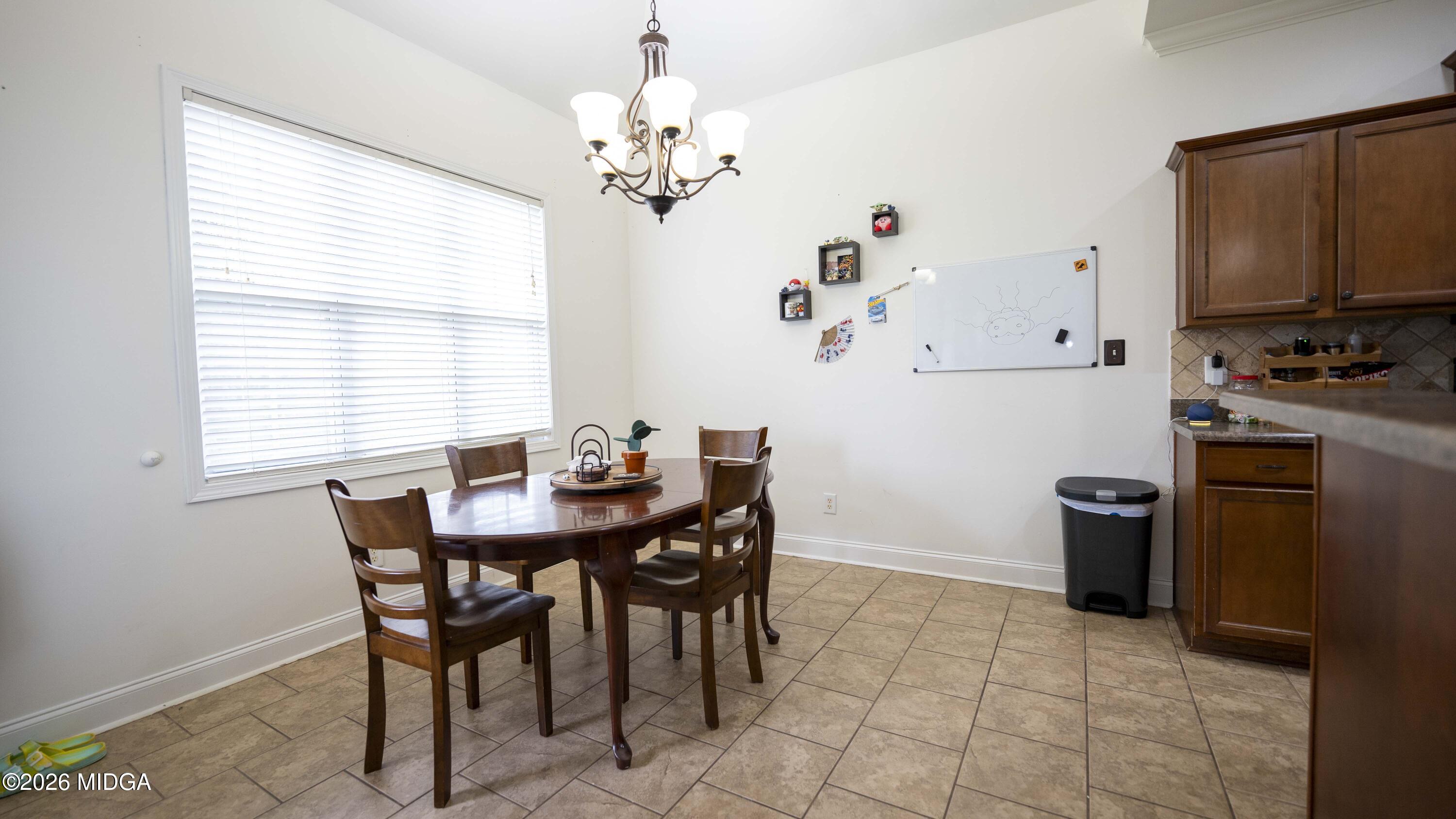 207 Broderick Circle Warner Robins, GA 31088 - Photo 12 of 33 a view of a dining room with furniture and window
