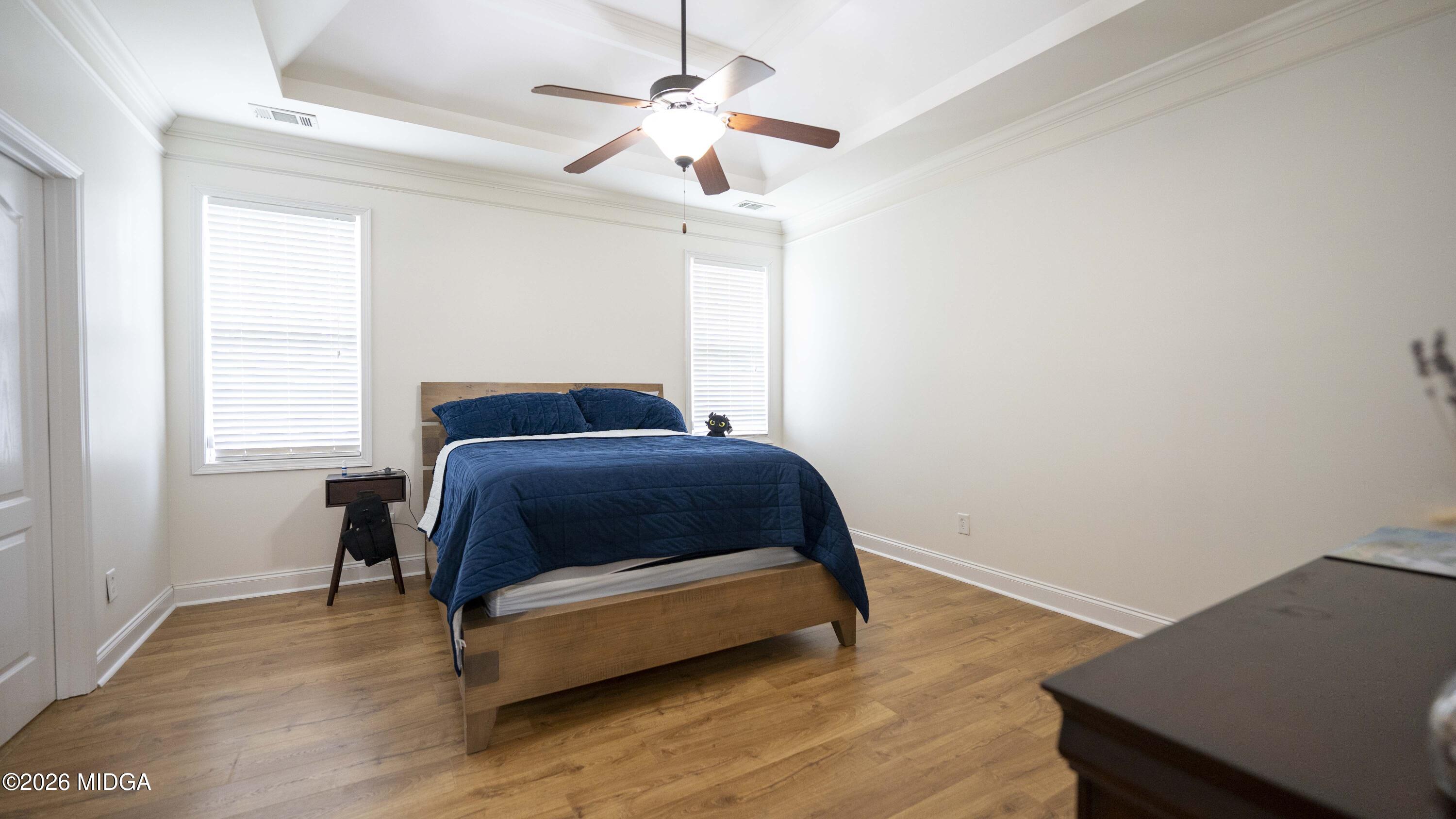 207 Broderick Circle Warner Robins, GA 31088 - Photo 22 of 33 a bedroom with a bed and a window