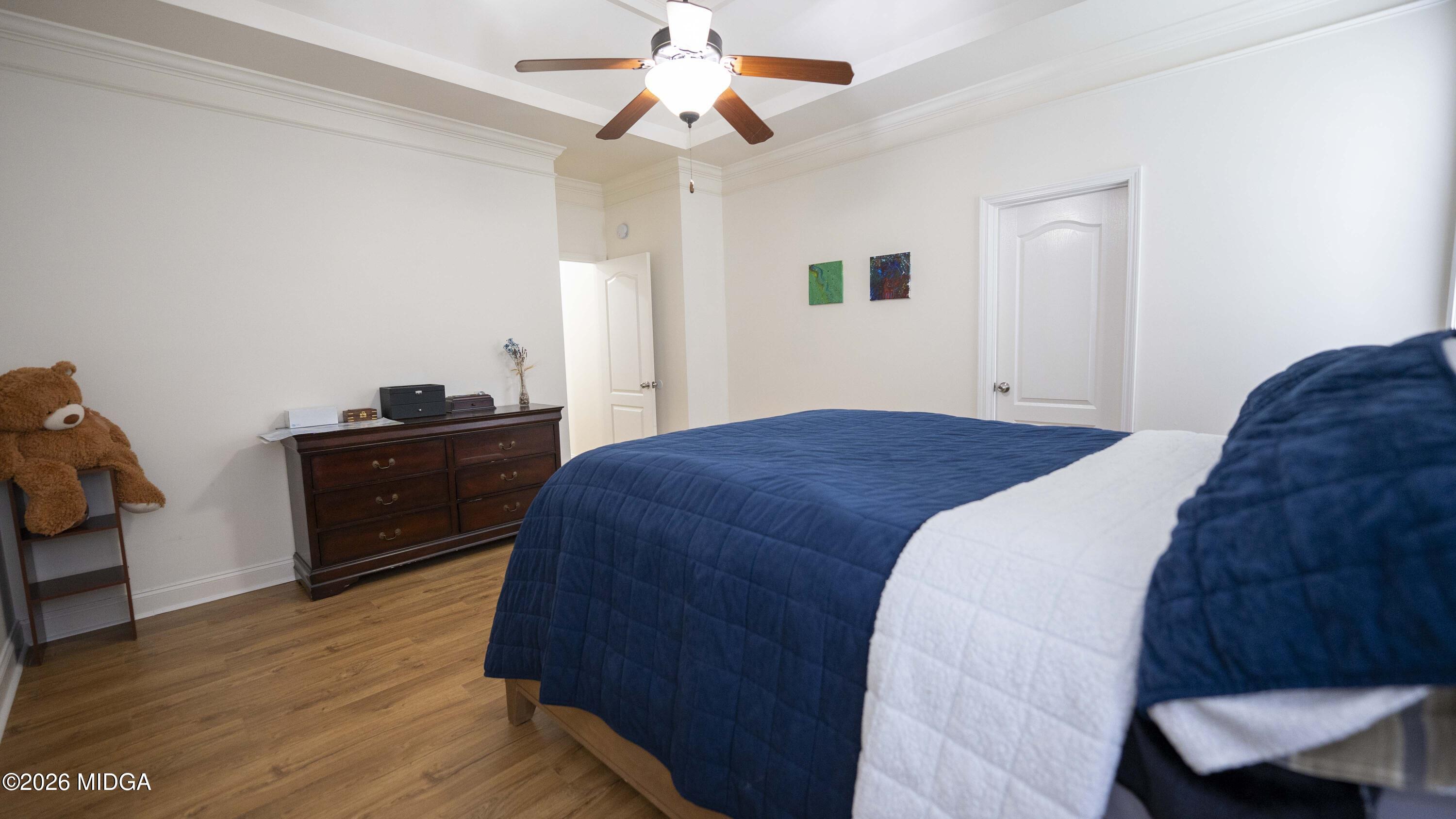 207 Broderick Circle Warner Robins, GA 31088 - Photo 23 of 33 a bedroom with a bed and a chandelier