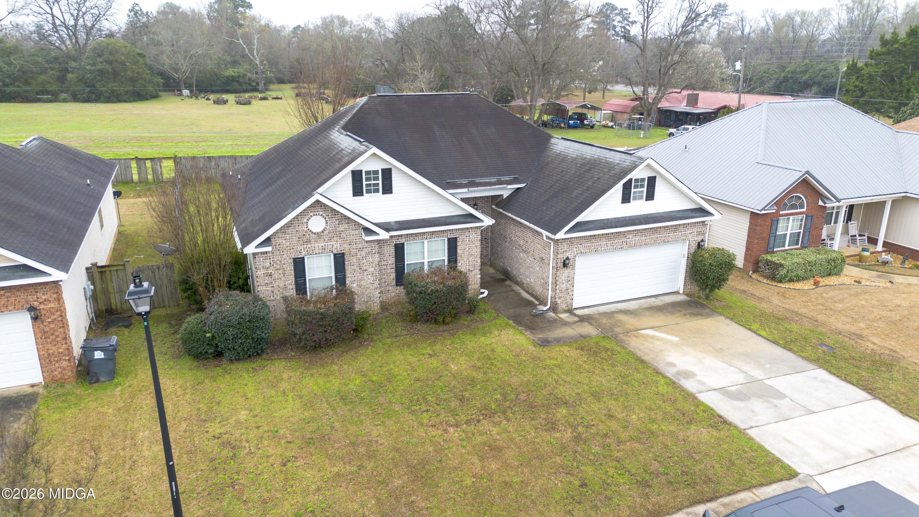 207 Broderick Circle Warner Robins, GA 31088 - Photo 3 of 33 a aerial view of a house with swimming pool and a yard