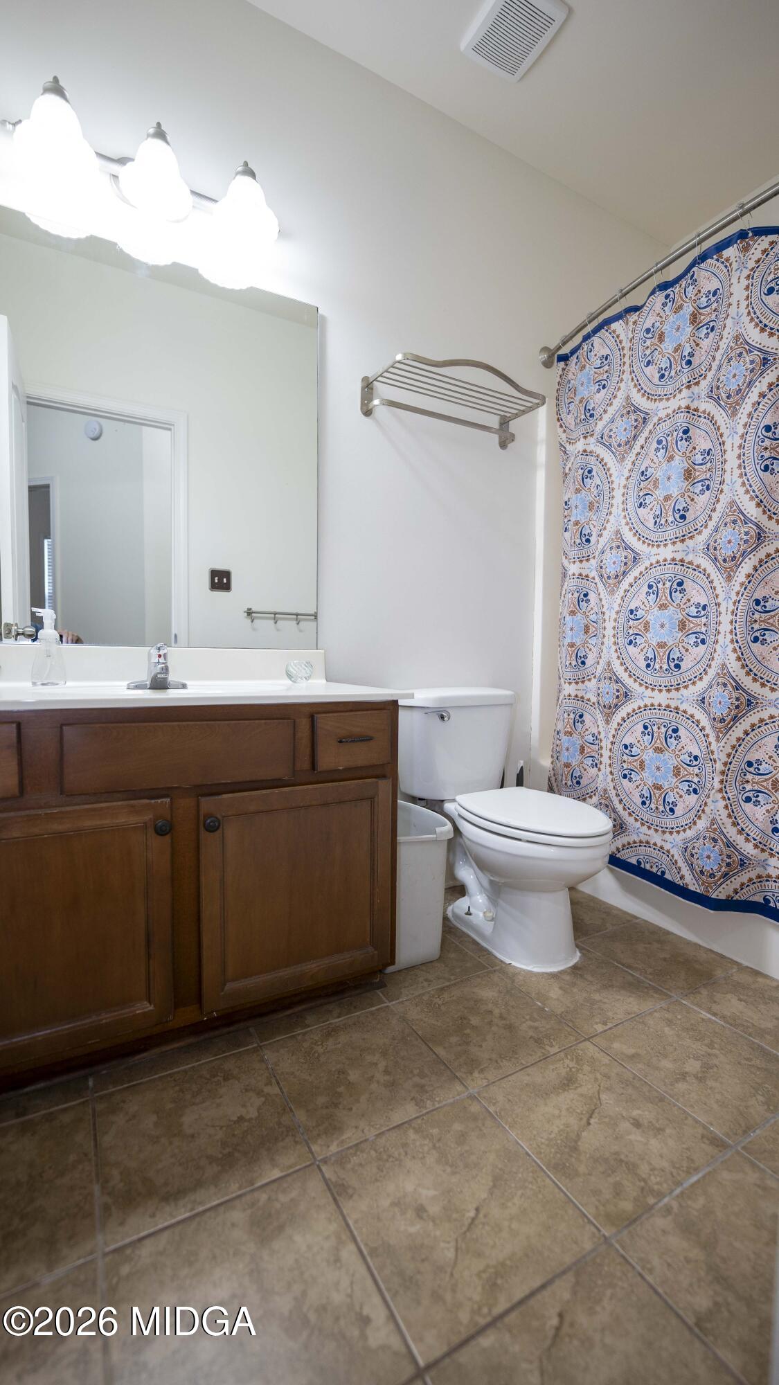 207 Broderick Circle Warner Robins, GA 31088 - Photo 31 of 33 a bathroom with a sink toilet and shower