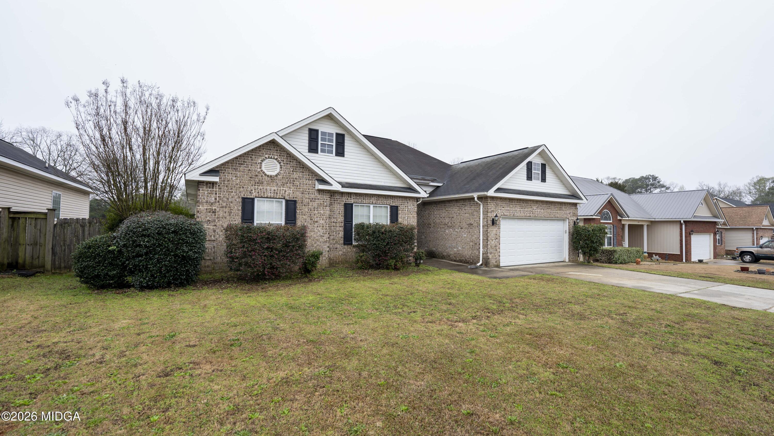 207 Broderick Circle Warner Robins, GA 31088 - Photo 7 of 33 a view of a house with a yard and large tree