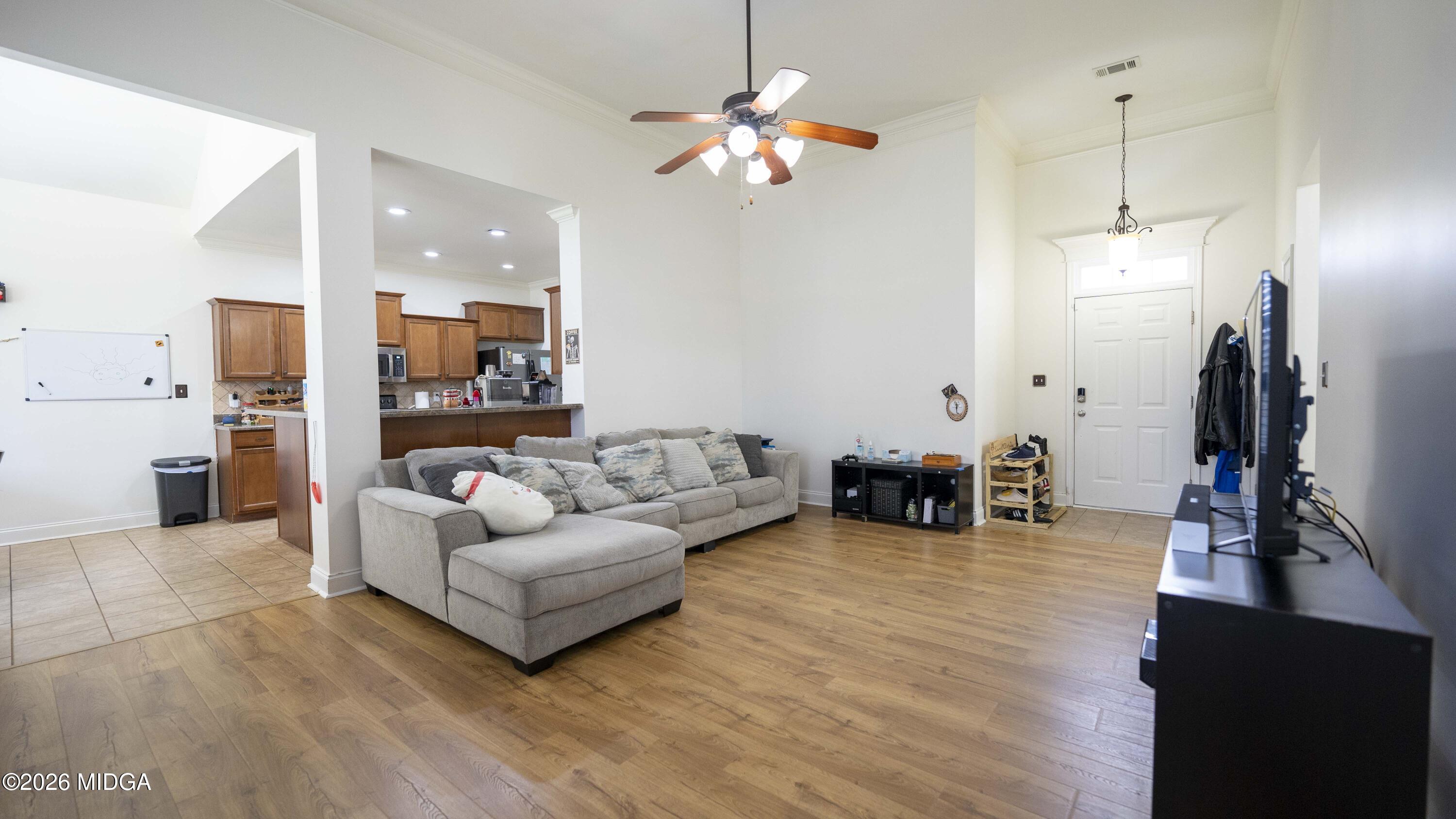 207 Broderick Circle Warner Robins, GA 31088 - Photo 10 of 33 a living room with furniture and a chandelier