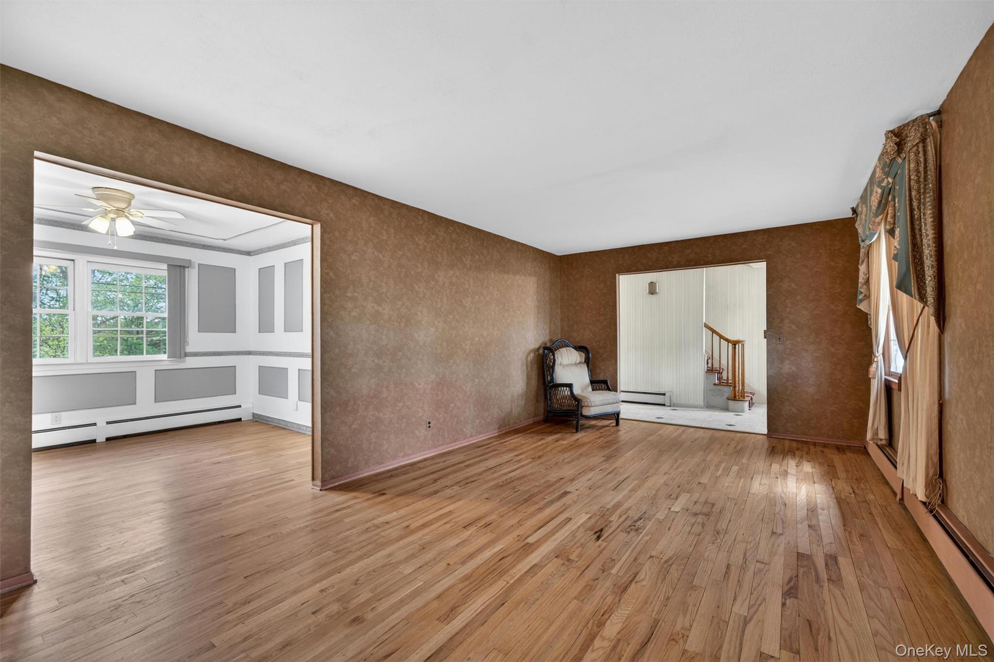 155 Pine Tree Road Monroe, NY 10950 - Photo 7 of 49 an empty room with wooden floor and a window