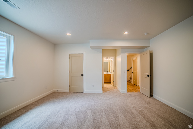 223 South Cottonwood Road, Unit 7501 Vineyard, UT 84059 - Photo 10 of 45 Spacious room featuring neutral carpet flooring, recessed lighting, and a white window with horizontal blinds