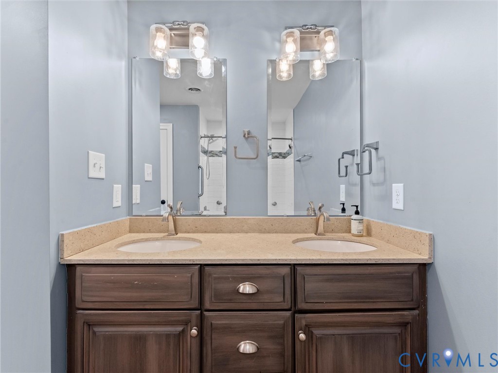 11390 Rocky Ridge Road Glen Allen, VA 23059 - Photo 74 of 82 Dual vanity with wood-finish cabinetry, integrated