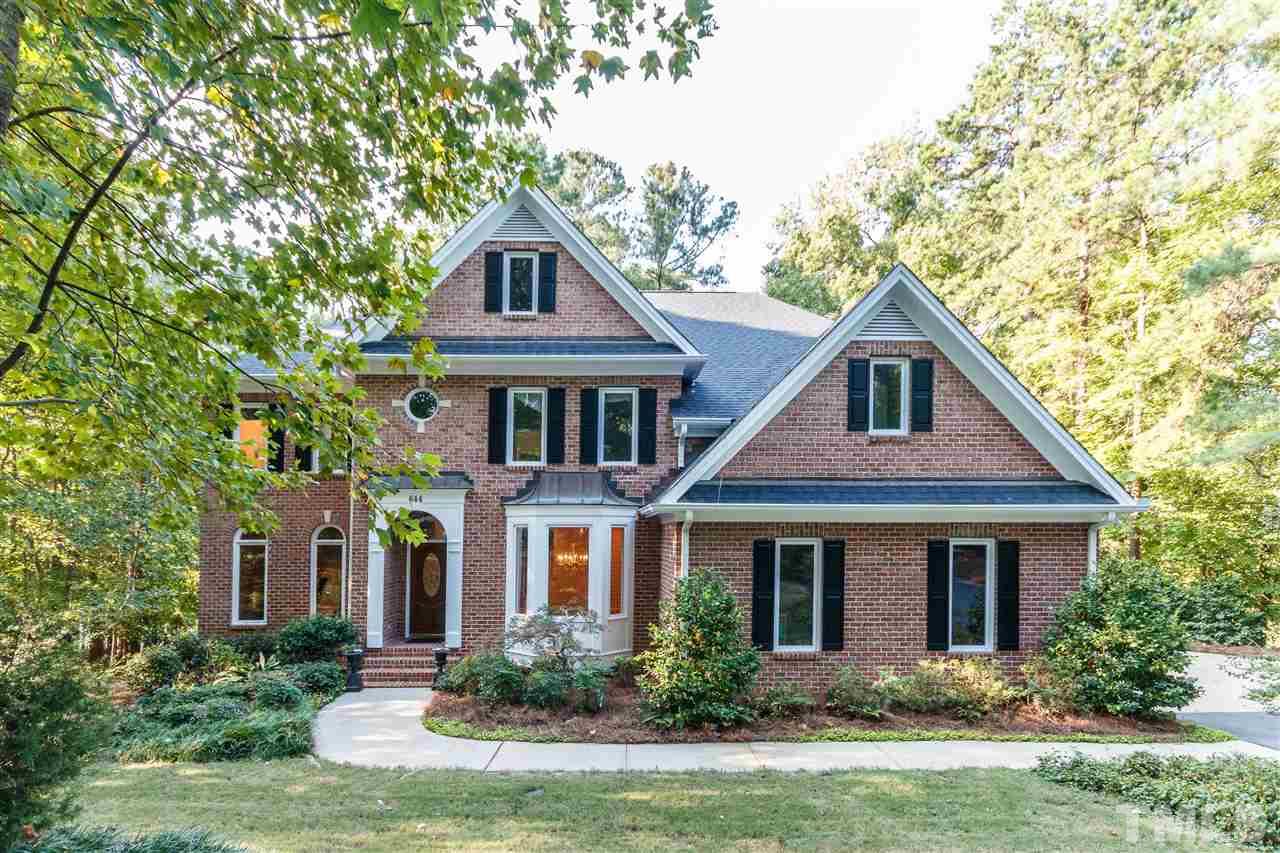 644 Pendleton Lake Road Raleigh, NC 27614 - Photo 1 of 25 a front view of a house with a yard and trees