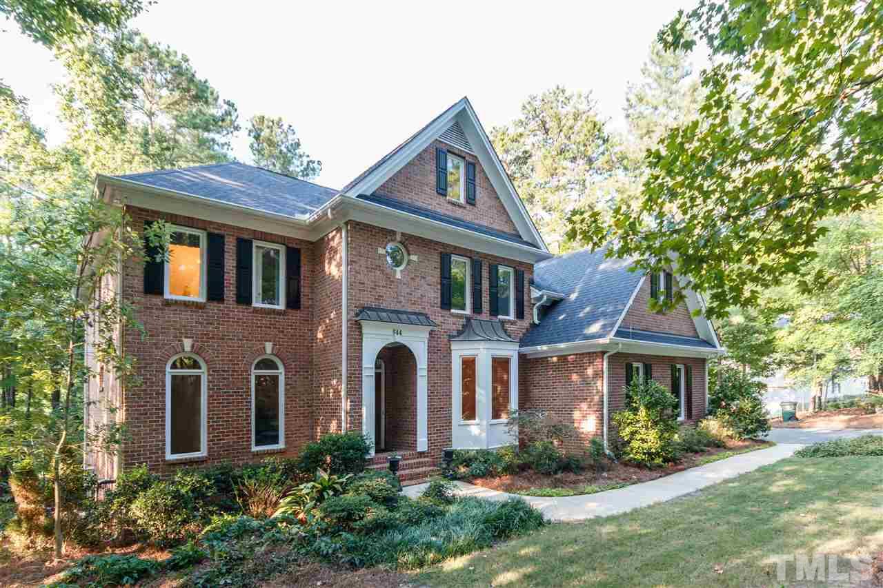 644 Pendleton Lake Road Raleigh, NC 27614 - Photo 2 of 25 a front view of a house with a yard and garage