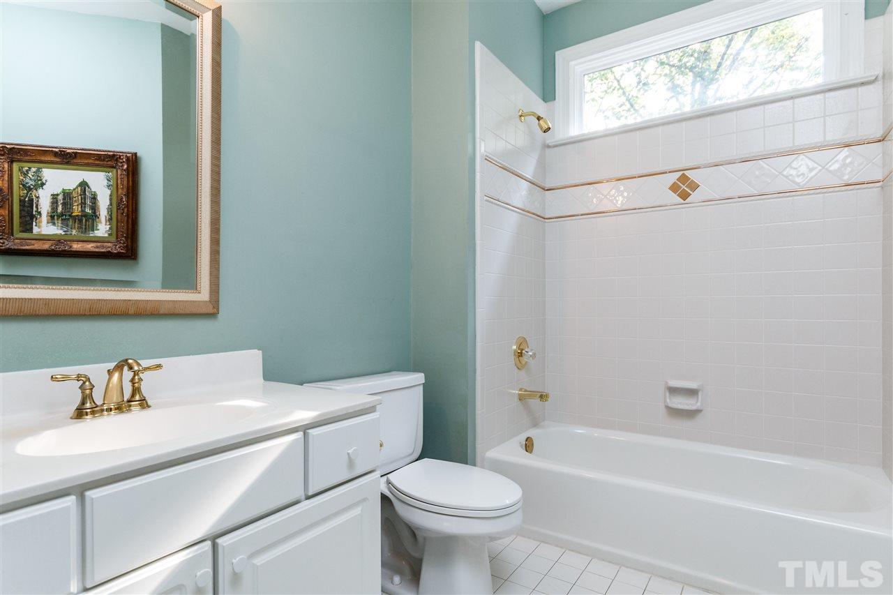 644 Pendleton Lake Road Raleigh, NC 27614 - Photo 14 of 25 a bathroom with a sink a toilet and a bathtub