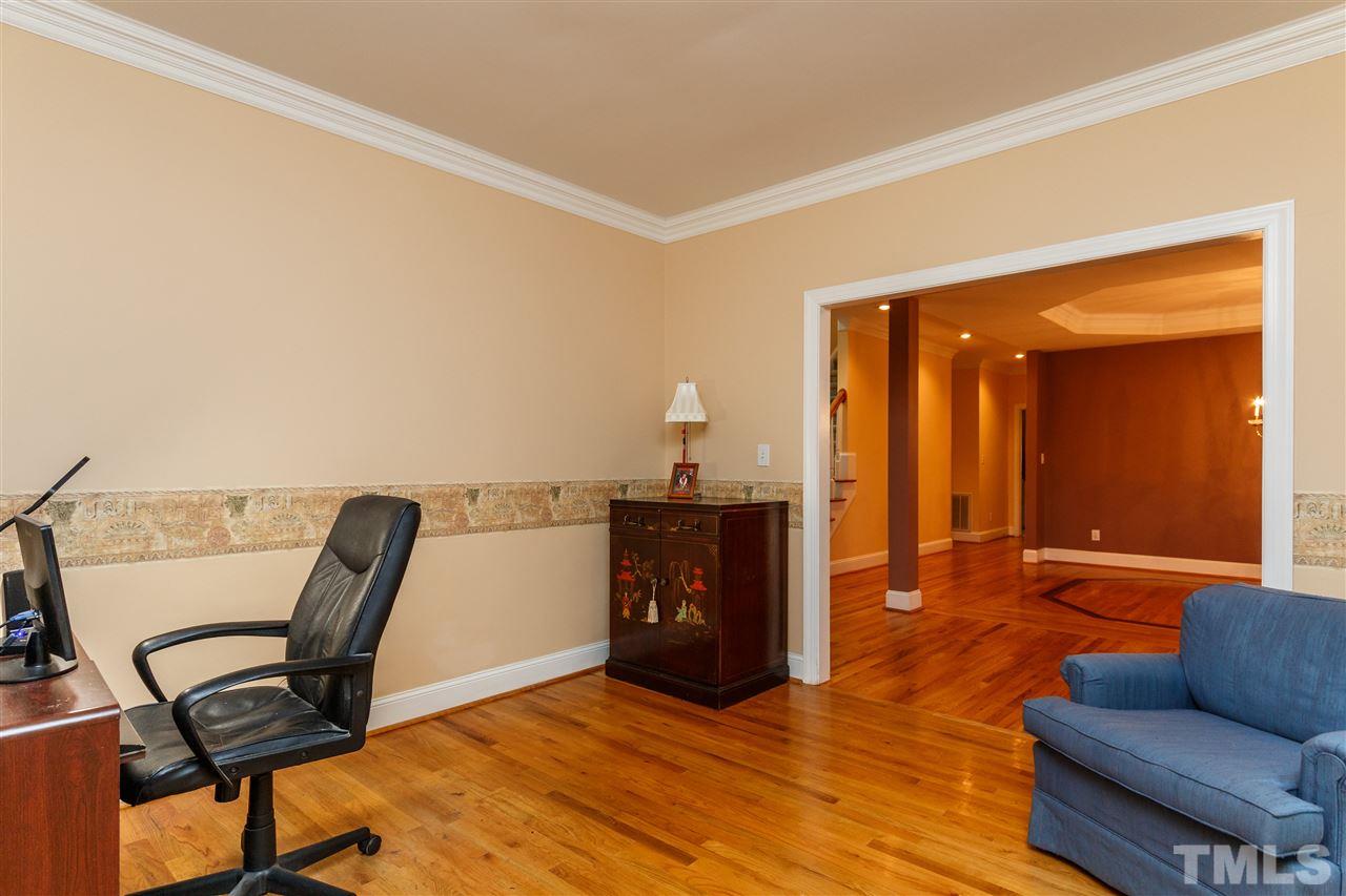 644 Pendleton Lake Road Raleigh, NC 27614 - Photo 4 of 25 a living room with furniture and a wooden floor
