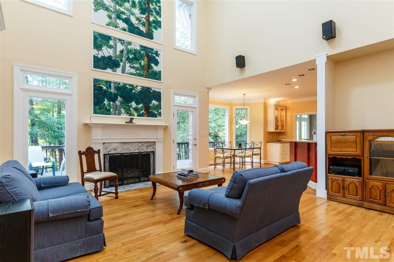 644 Pendleton Lake Road Raleigh, NC 27614 - Photo 6 of 25 a living room with furniture fireplace and a large window