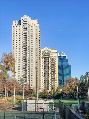 a view of a building with a yard