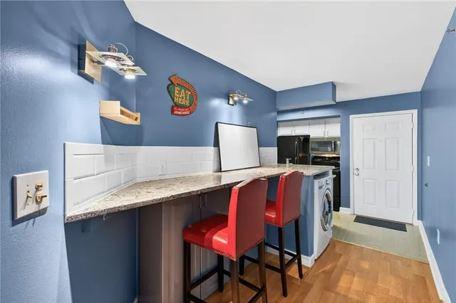 a living room with furniture and flat screen tv