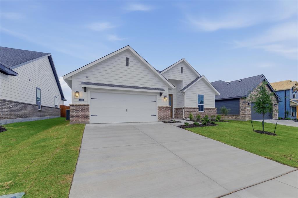 1329 Frio Drive Springtown, TX 76082 - Photo 2 of 25 Contemporary facade with white siding and a brick accent skirt