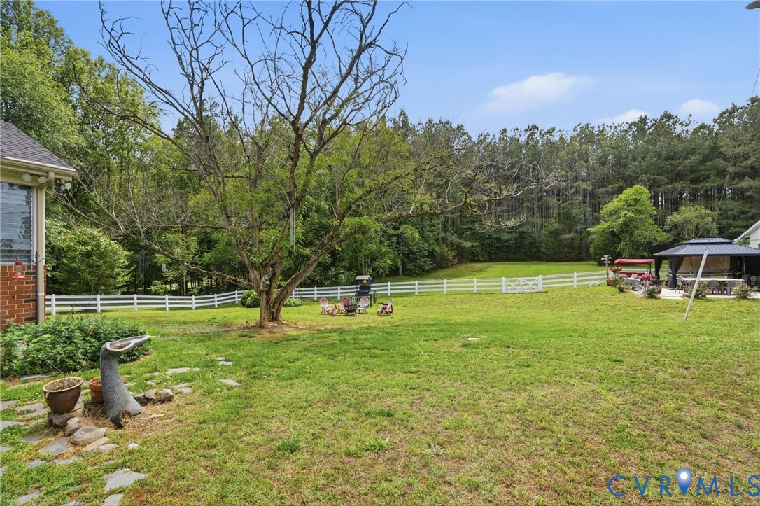 11016 Pridesville Road Amelia Court House, VA 23002 - Photo 45 of 54 Expansive rear yard featuring a manicured lawn, wh