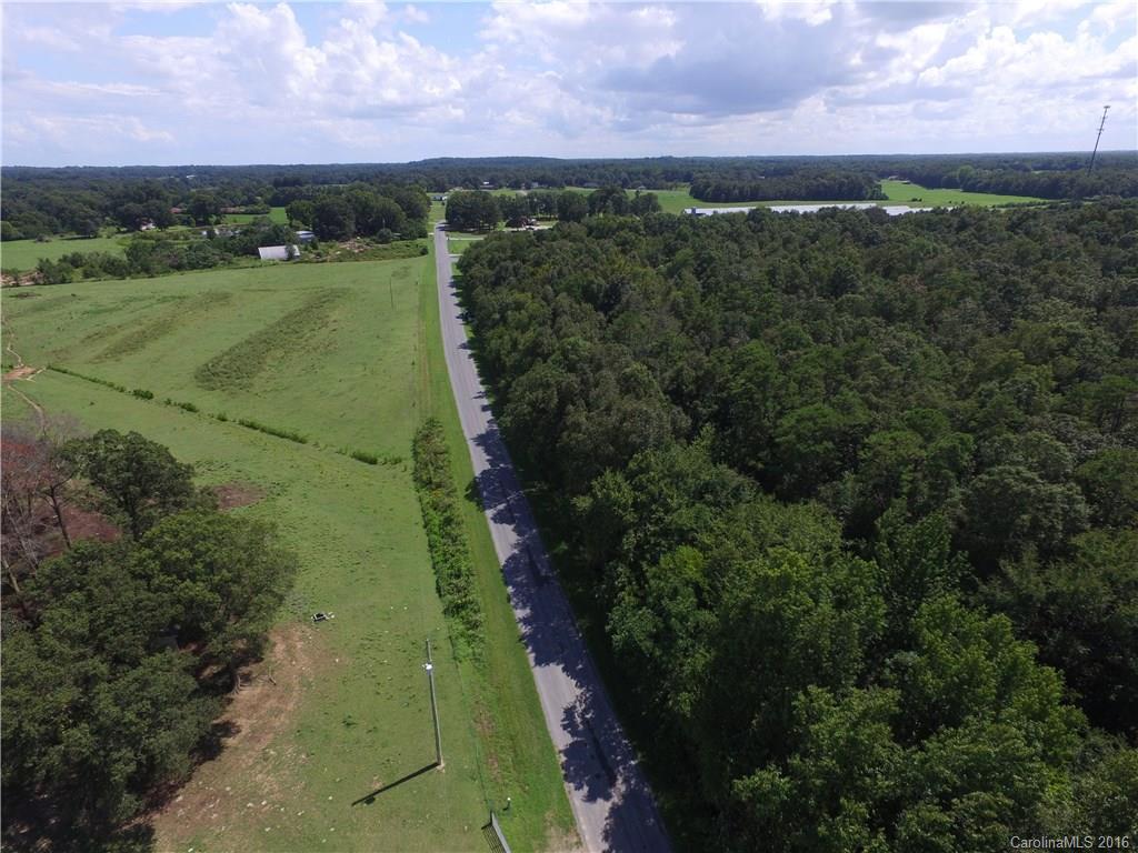 908 Price Tucker Road Monroe, NC 28110 - Photo 12 of 14 a view of a city with lush green forest