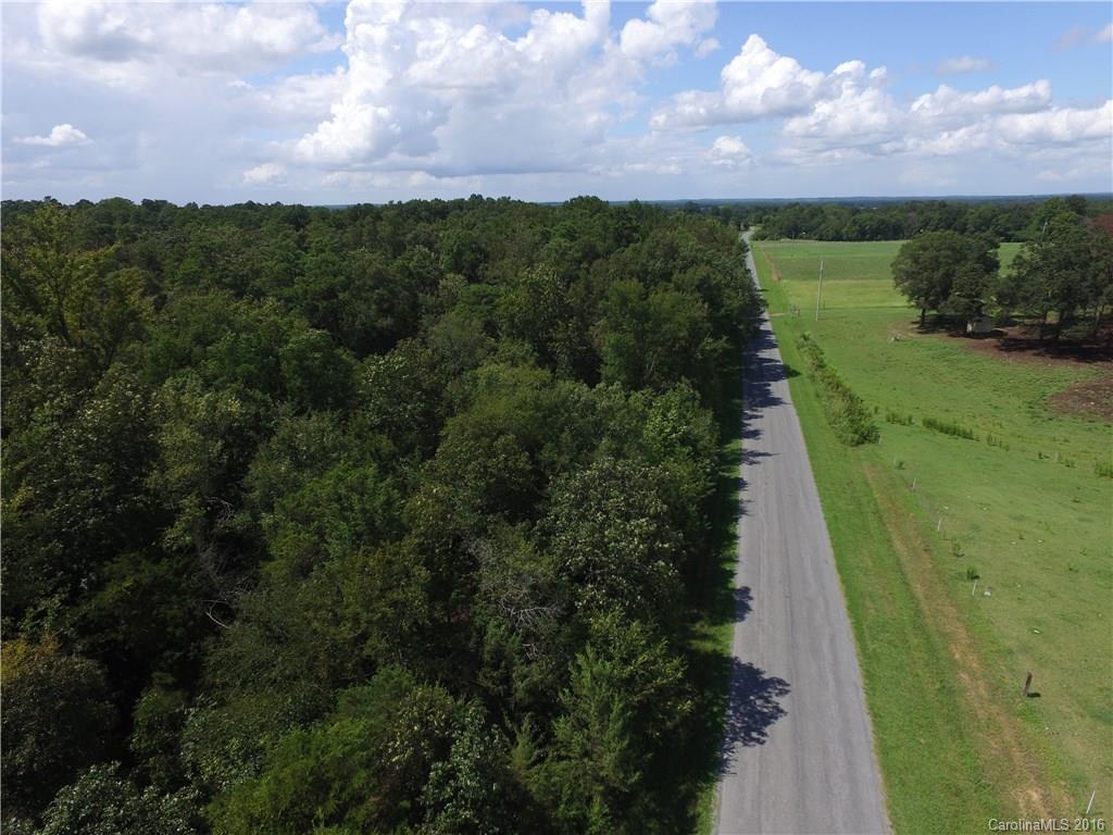 908 Price Tucker Road Monroe, NC 28110 - Photo 6 of 14 a view of a city with lush green forest
