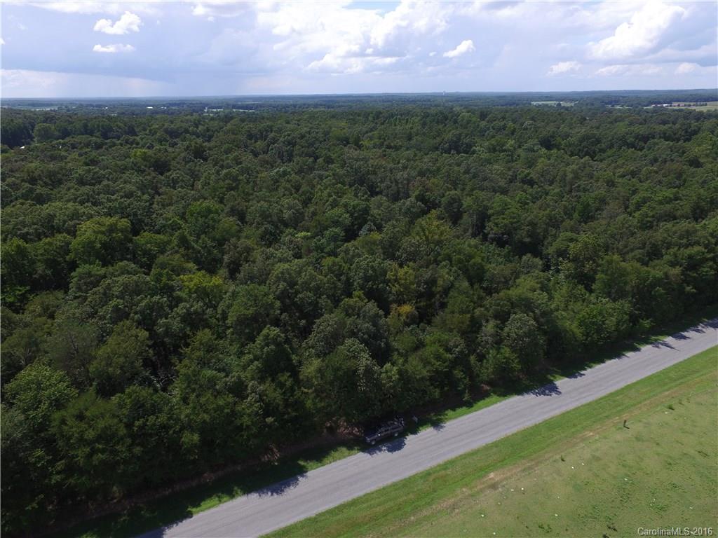 908 Price Tucker Road Monroe, NC 28110 - Photo 9 of 14 a view of a field with a yard