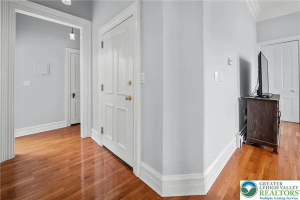 a dining area with furniture a window and kitchen view