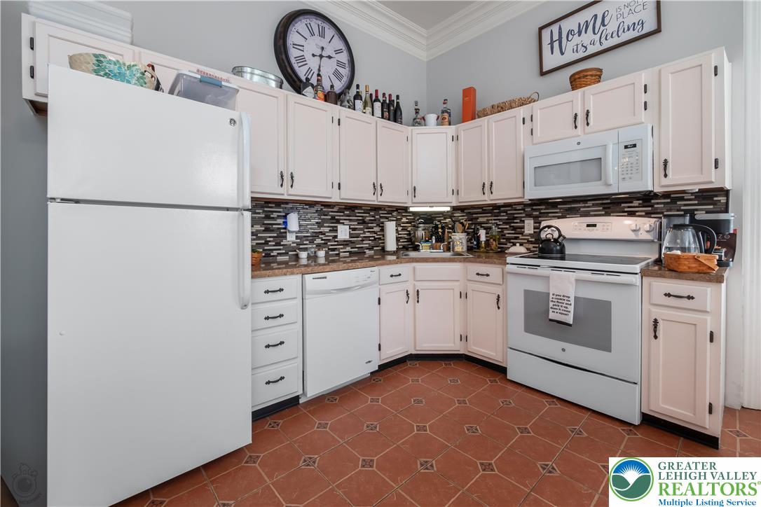 101 Northampton Street, Unit 2 Easton, PA 18042 - Photo 15 of 26 a kitchen with white cabinets and white appliances