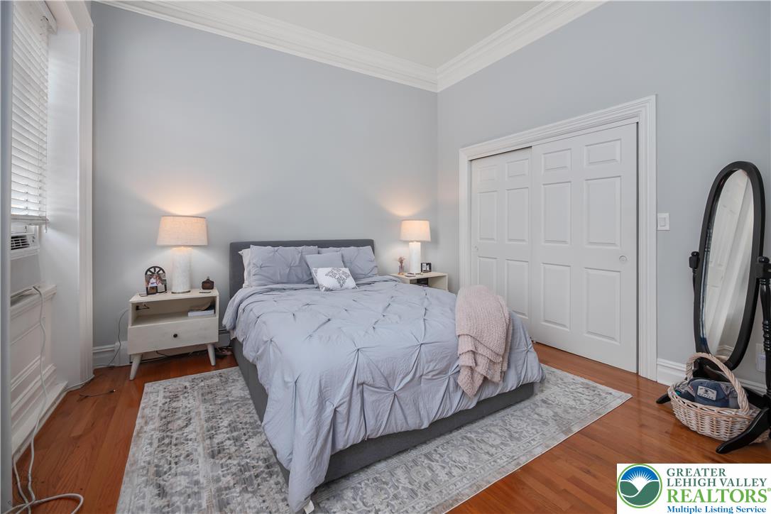 101 Northampton Street, Unit 2 Easton, PA 18042 - Photo 17 of 26 a bedroom with a bed and wooden floor